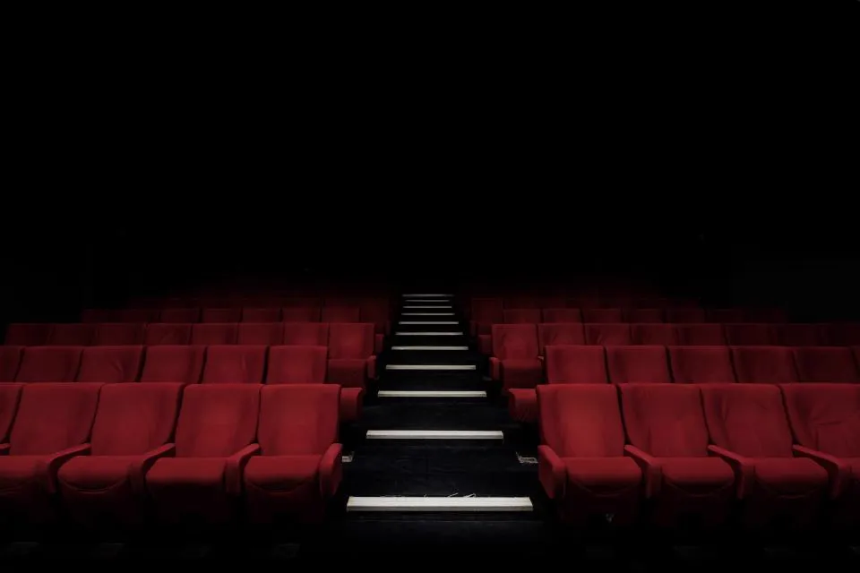 Dark stadium seats opening into the live proppicks board